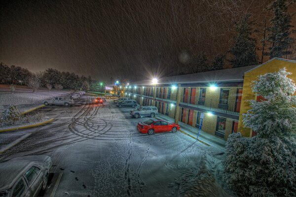 Car tracks in the snow at the hotel