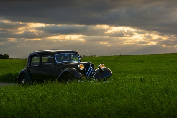 Collectible car on the background of a beautiful sunset