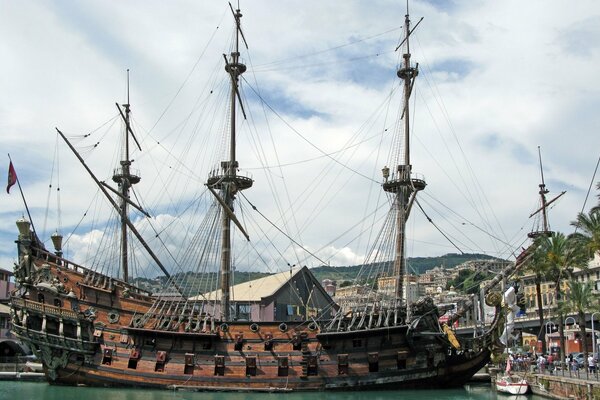 Three-masted ancient ship at sea