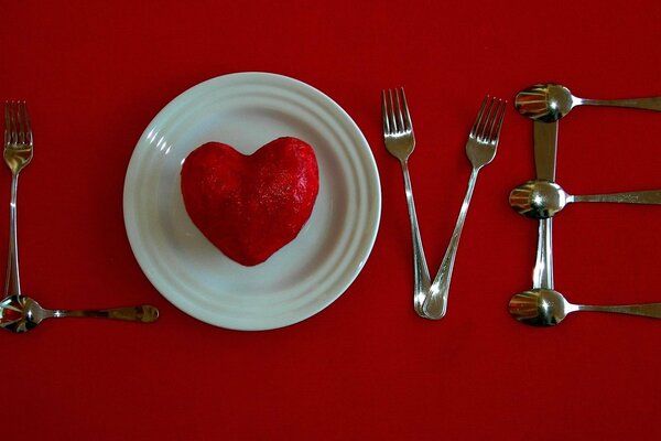 The word love on the table made up of cutlery