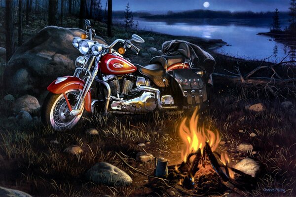 Night image of a motorcycle by a campfire on the river bank