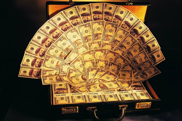 A suitcase with a lot of dollars