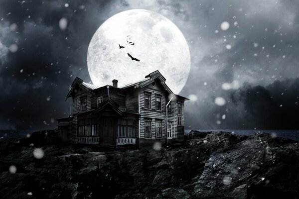 An abandoned haunted house in the light of a huge moon