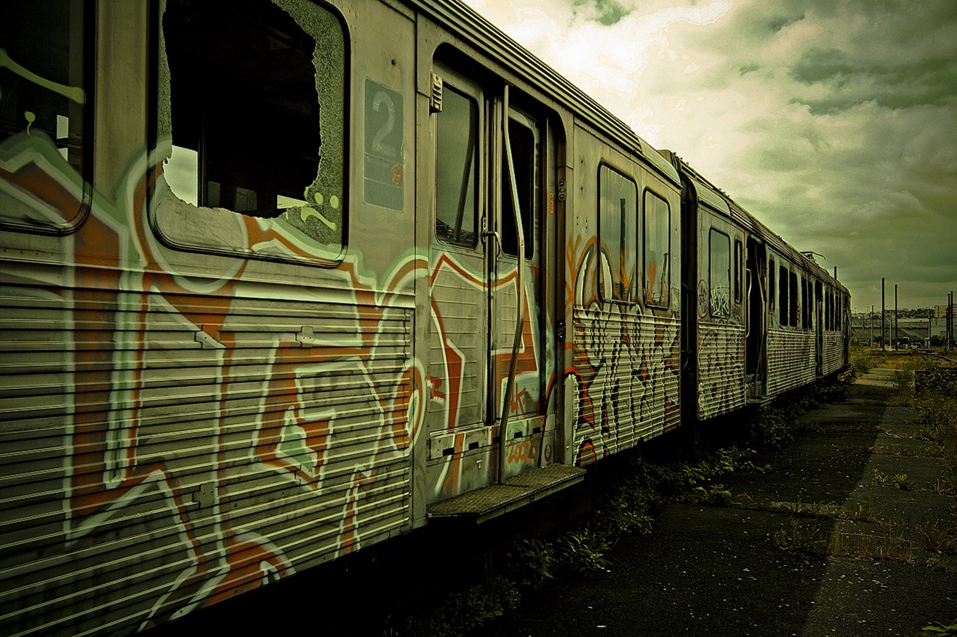 carriage graffiti train commuter train abandoned wasteland