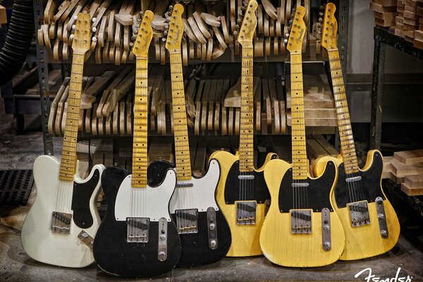 Gitary w kolorze czarnym, żółtym, białym