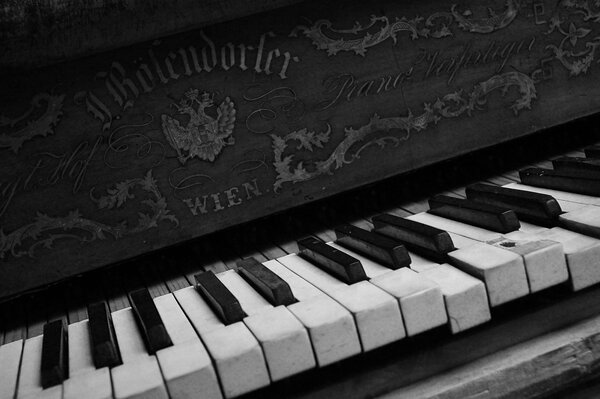 Black piano with open keys