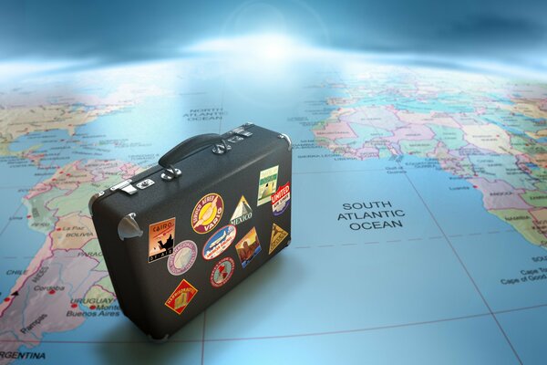 Reisen mit einem Koffer auf der Weltkarte