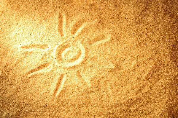 Drawing of the sun on loose sand