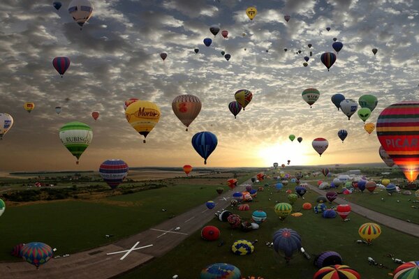 Hot air balloon flight across the colored sky