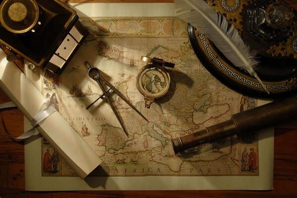 Images of compass, map, and backyard pipe