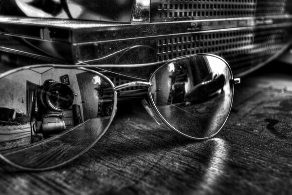 Reflejo de la lente de la cámara en gafas