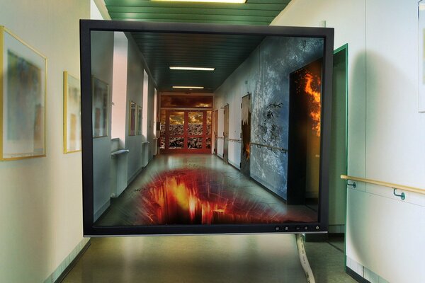 Monitor screen in the courtyard of the building. Fire on the monitor screen