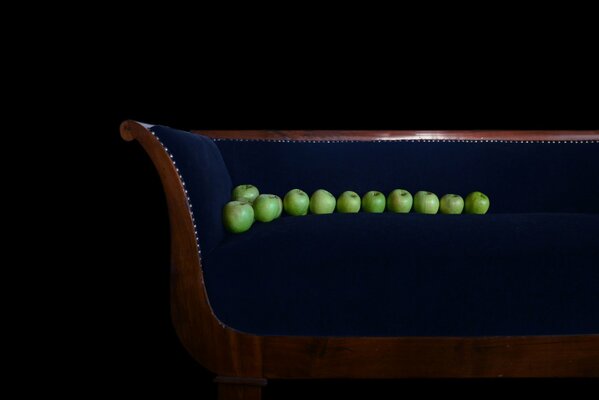 Green apples on the sofa for background