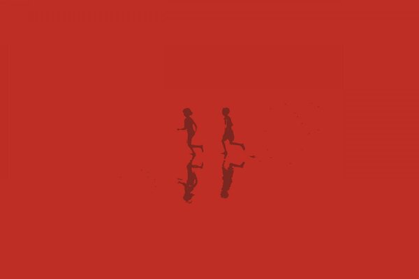 Reflexionen der Silhouetten der laufenden Kinder auf rotem Hintergrund
