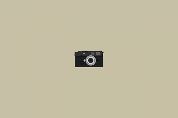 Minimalism camera on beige background