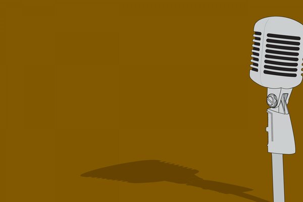 The shadow of a retro microphone on a brown background