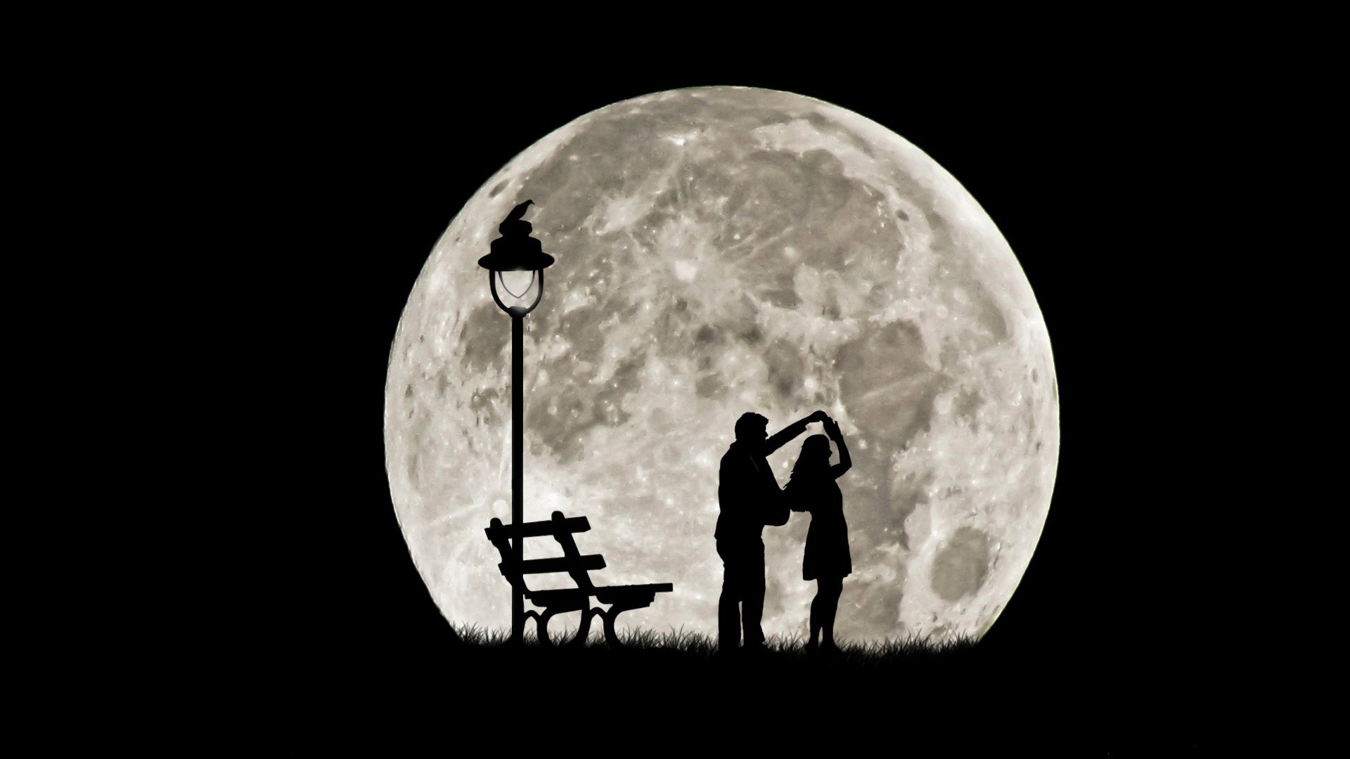 full moon silhouettes the pair dance