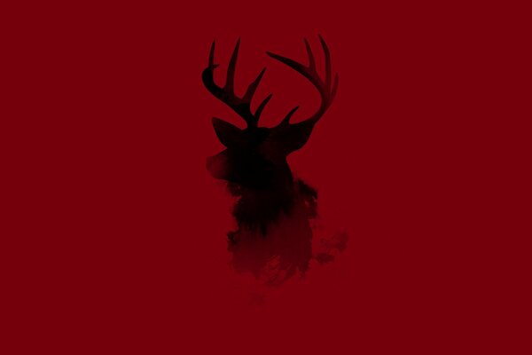 Silhouette of a deer on a red background