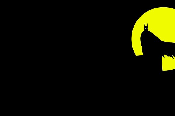 La silueta de Batman contra la Luna amarilla