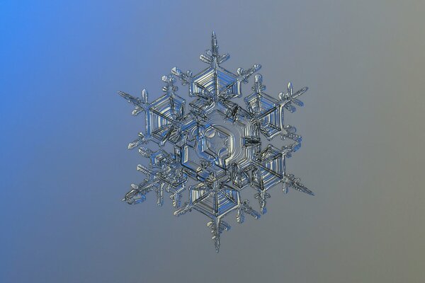 Crystal snowflake on a blue-blue background