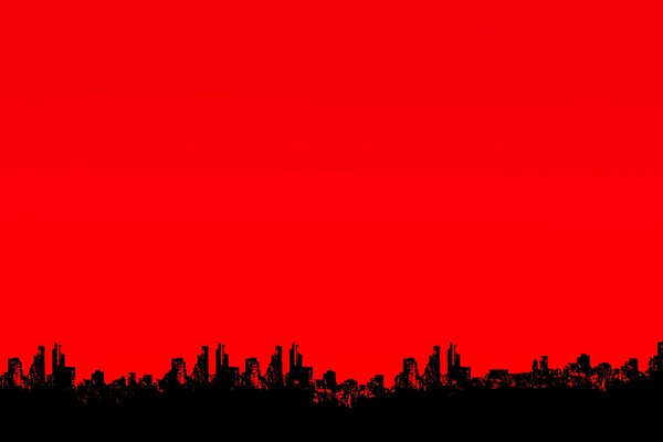 Silhouettes of the city in the red sky