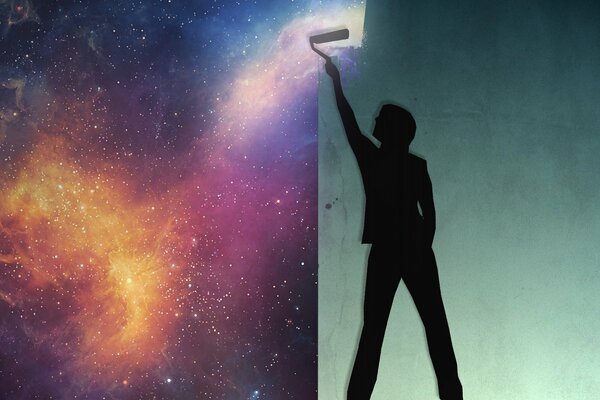Homme peint un mur dans un ciel étoilé