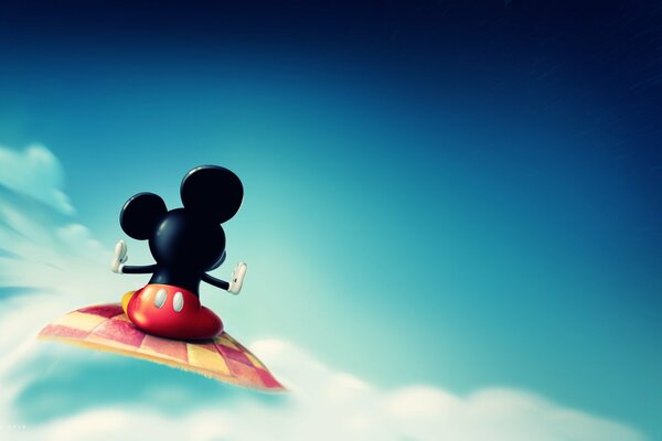 Mickey Mouse sur un tapis multicolore dans les nuages