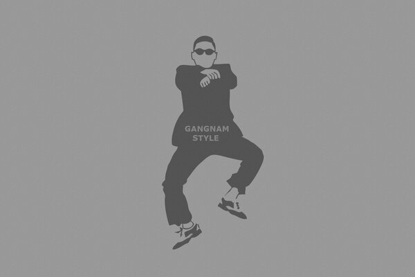 Mann im Gangnam-Stil mit Brille auf grauem Hintergrund