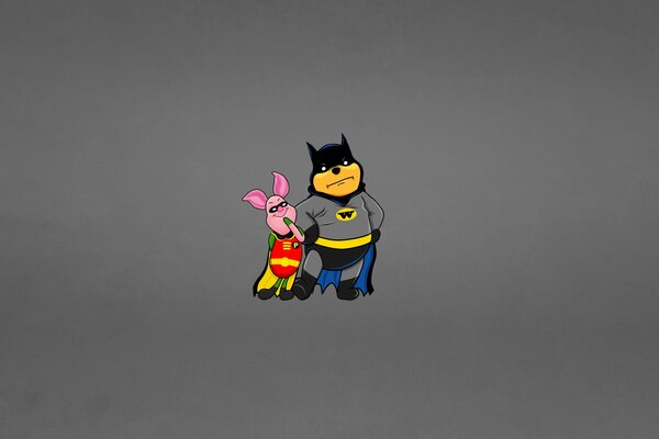 Los talones y Winnie the Pooh en trajes de Batman