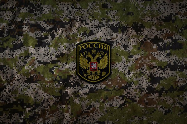 Russian Army badge on camouflage background