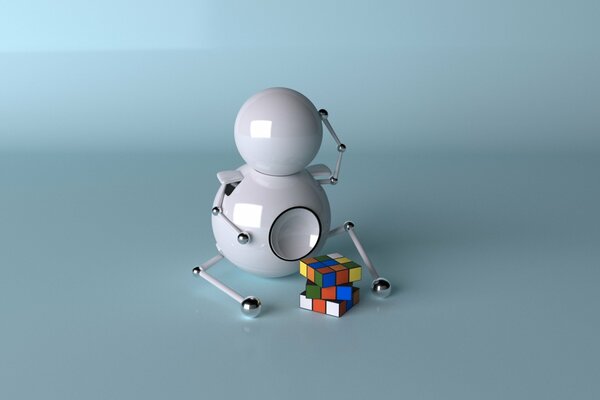 Petit robot assis sur un cube de Rubik