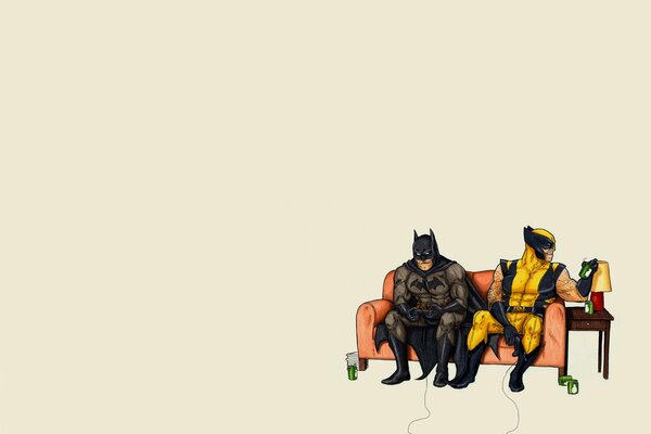 Batman and Wolverine play on the couch