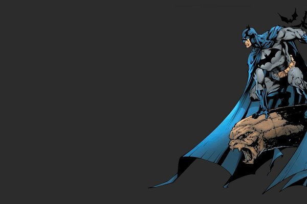 Comic-Superheld Batman fliegt auf einem Wasserspeier