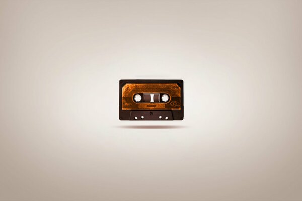 Minimalistic image of the cassette on a beige background