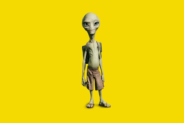 Alien confiant sur fond jaune