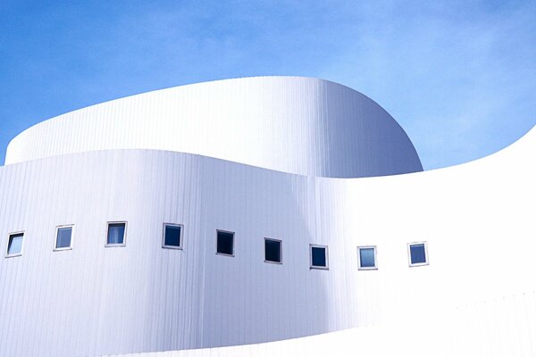 A white building against a blue sky