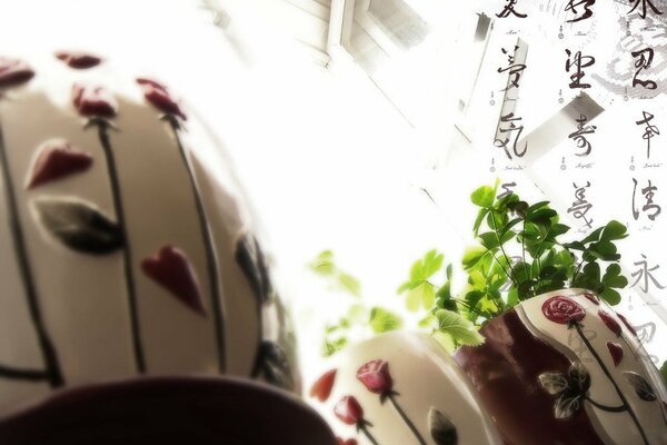 Painted flower pots on the window