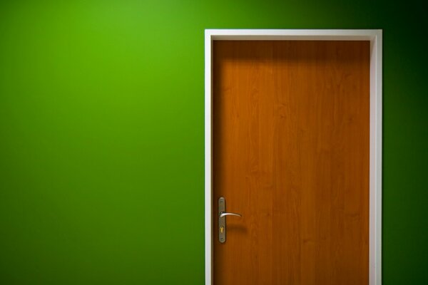 Green painted wall and wooden door with handle