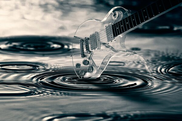 Transparent guitar. Circles on the water