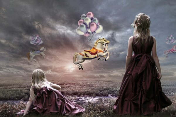 Les deux filles regardent volante cheval de bataille de ballons