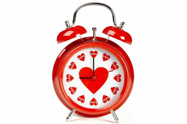 Red alarm clock with hearts for Valentine s Day