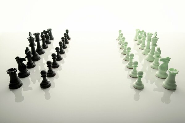 Chess pieces are displayed on a glossy white surface