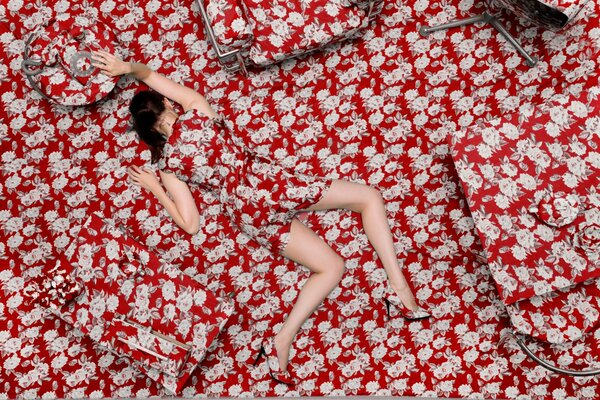 The girl completely fit into the interior of the floral background