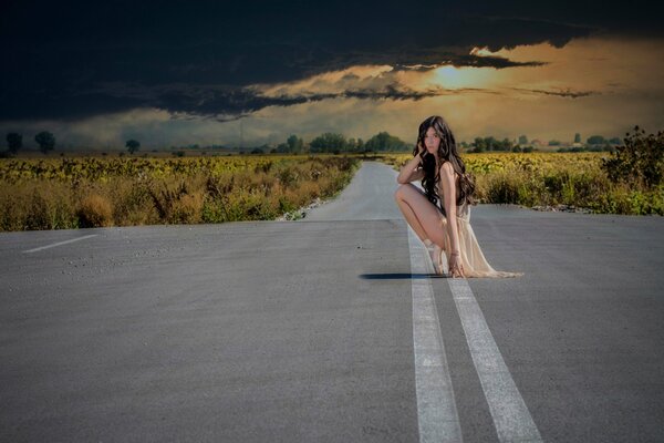 A ballerina girl on a deserted road