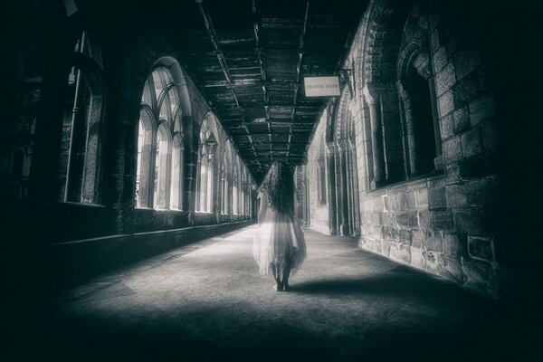Ghost girl walks in an old castle