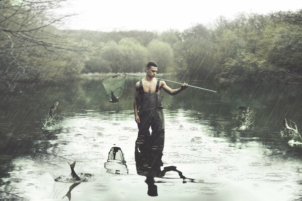 A guy on a fishing trip in rainy weather