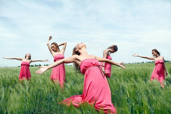 Girls in pink dresses dancing