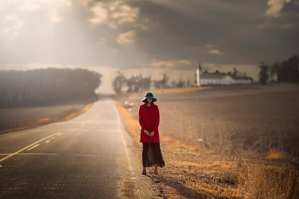 Beautiful girl in a red coat