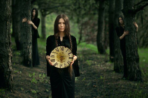 The girl with the clock in the forest