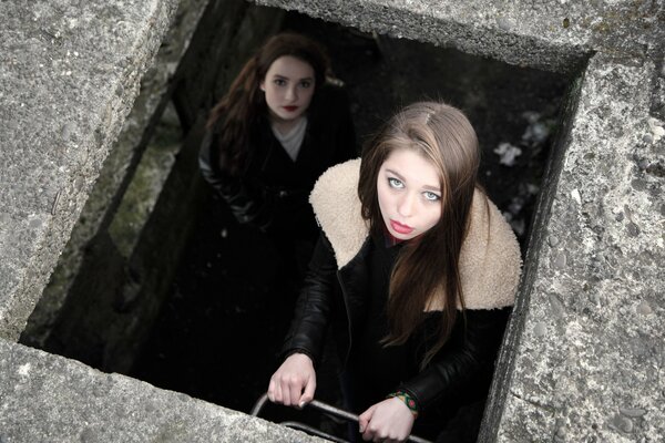 Photos of girls climbing out of the basement